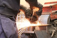https://upload.wikimedia.org/wikipedia/commons/thumb/5/5f/Grinding_in_a_construction_firm.jpg/220px-Grinding_in_a_construction_firm.jpg